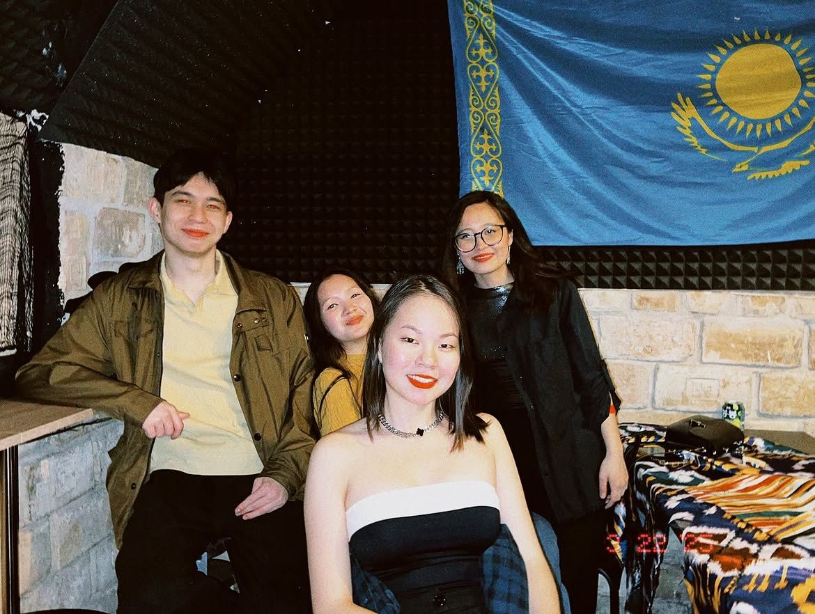 Friends celebrating with the Kazakhstan flag at Budapest Tunderi